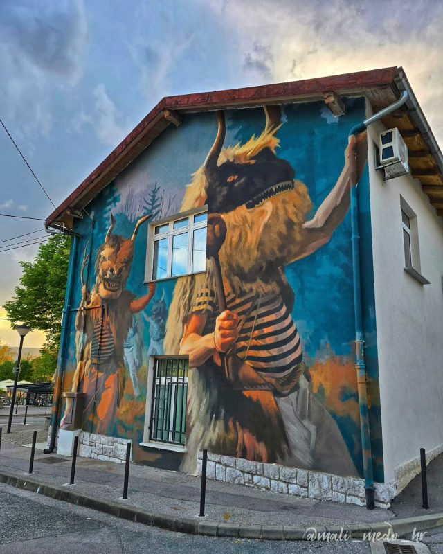 The largest mural in Croatia dedicated to the Halubajski zvončari (engl. Halubaj Bell Ringers or Halubaj Bellmen) made by famous croatian streetart artist lonacpot
Zvončari is the characteristic folk custom maintained in the region of Rijeka and surrounding areas in Croatia. It was added to UNESCO's Representative List of the Intangible Cultural Heritage of Humanity in 2009..
The Halubaj Bell Ringers, from the eastern part of the Kastav region, near Rijeka, are the most recognizable bearers of the cultural heritage of cattle carnival magic in Croatia. The Kastav region is a region that once abounded in pastures and sheep. Thus, according to stories, in the spring, shepherds, going after their sheep into the forests, would put on sheepskin and hang cowbells around their waists, thus deterring evil forces from their animals. They believed that the bells brought them luck. In their costumes and equipment, they preserved zoomorphic (animal-shaped) masks with horns and a large bell on their backs. They are dressed in sheepskins and carry balta (Hungarian: axe), bačuka or macuka in their hands, which indicates their warrior origins. During the international Rijeka Carnival, Zvončari march from village to village throughout the region, following the same centuries-old route, making an extraordinary amount of noise, fueled in part by the wine provided by the locals' en route. They also regulary participate in Carnival and for years they are the Carnival's main atraction.
.
#zvoncari #halubajskizvoncari #tradition #famous #unesco #unescoheritage #kucazvoncara #kucahalubajskihzvoncara #kastav #matulji #bregi #zamet #grobnik #rijeka #rijeckikarneval #streetart #mural #muralart #visitviskovo #visitrijeka #visitopatija #travel #explore #enjoythemoment❤️ #enjoytheview